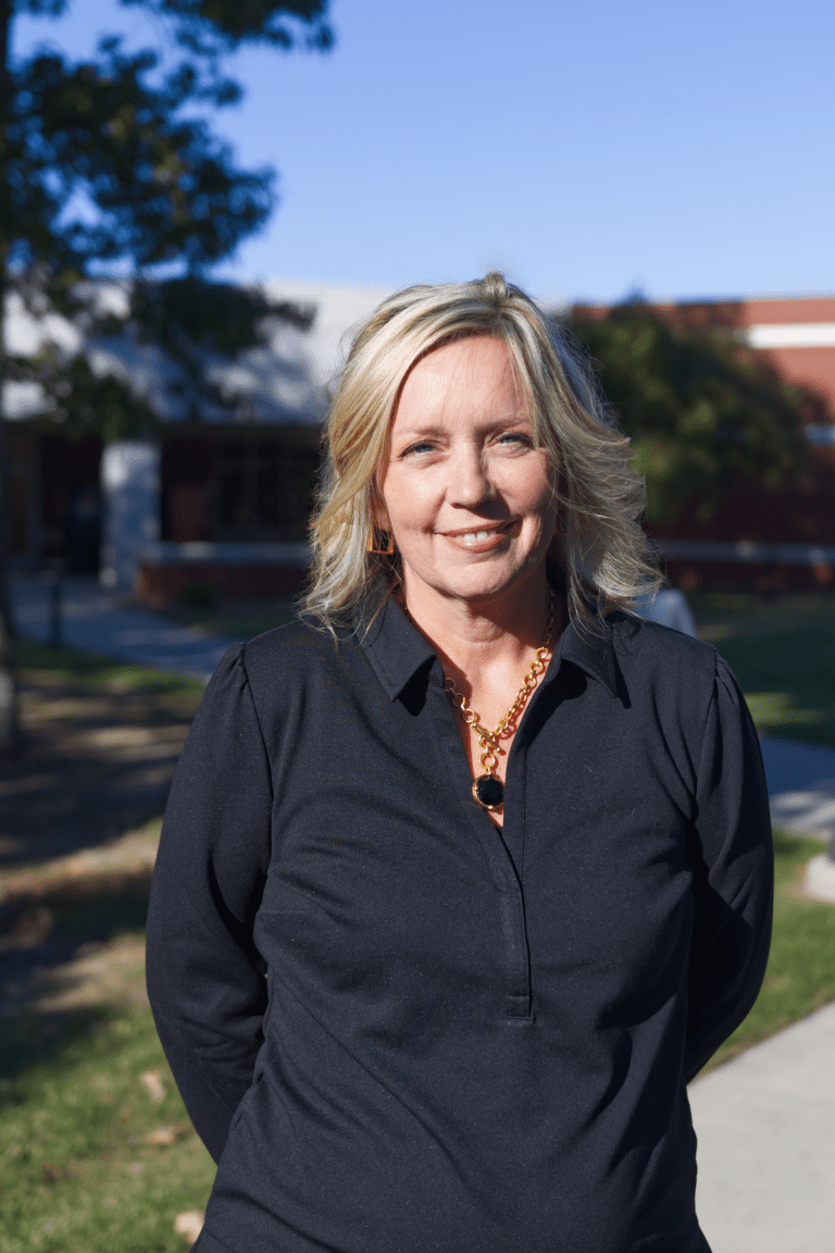 Photo of a woman in a black shirt.