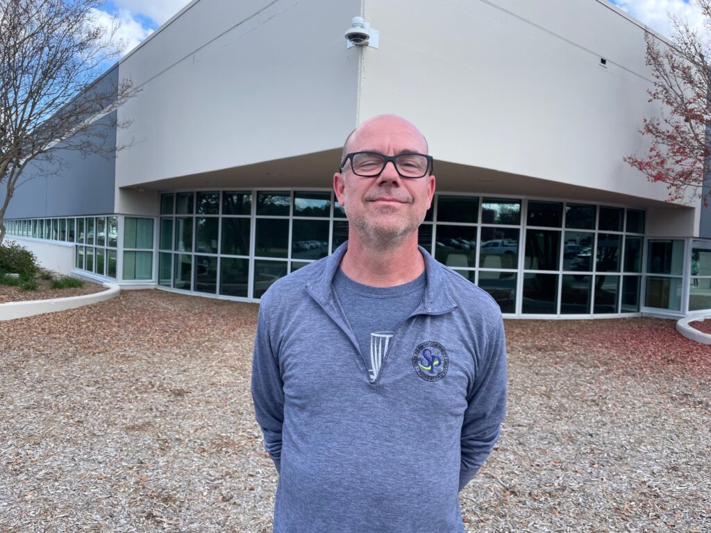 Photo of David Wheeler in front of Building A on South Piedmont's Old Charlotte Highway campus.
