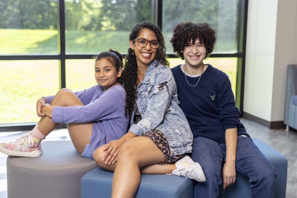 Jamie Hart, a HyFlex student at South Piedmont, posing with her two children.