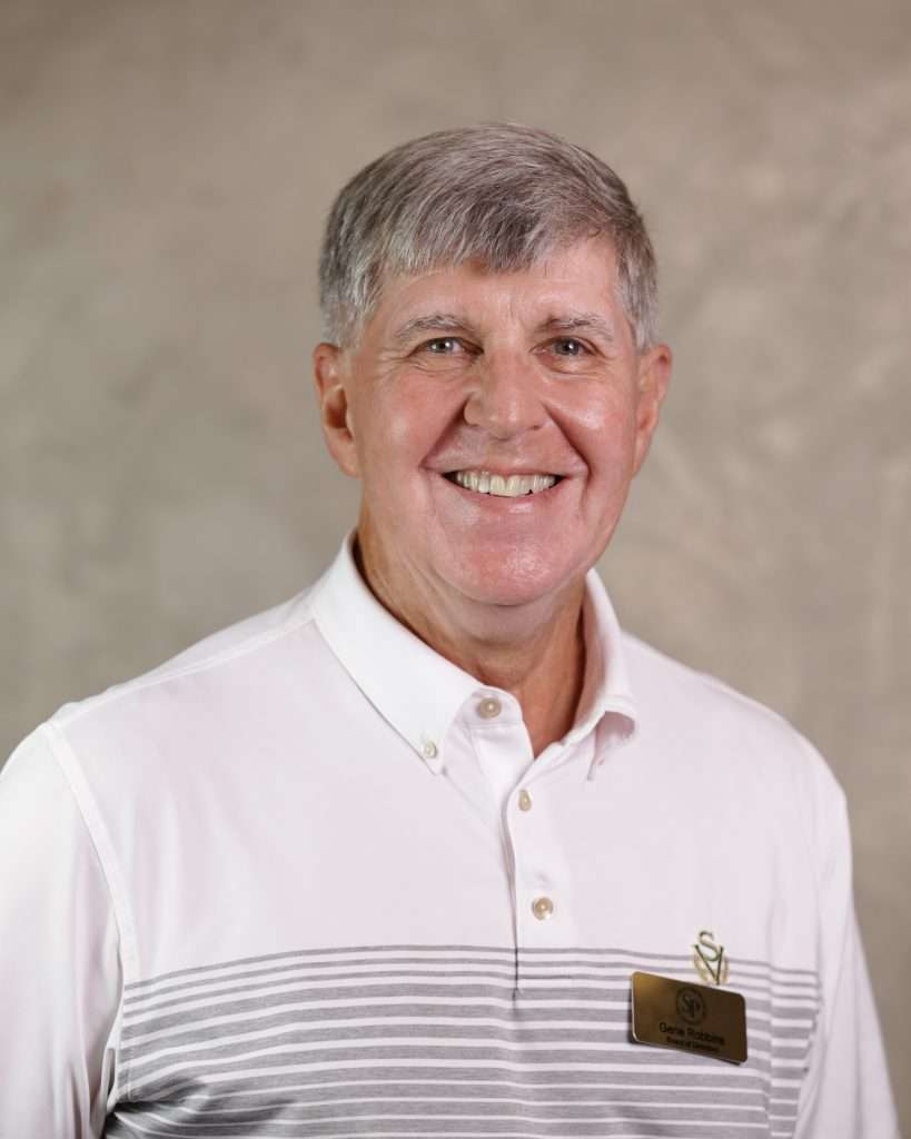 Photo of a man in a striped shirt.