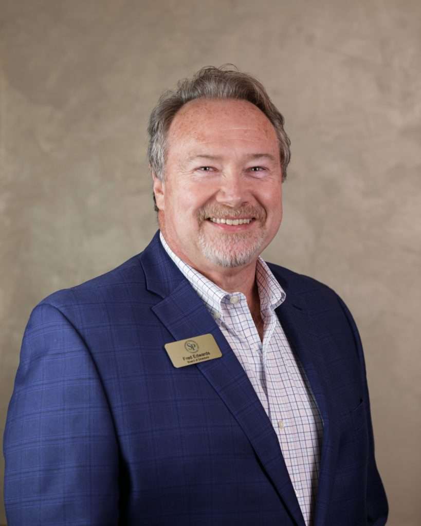 Photo of a man in a suit.