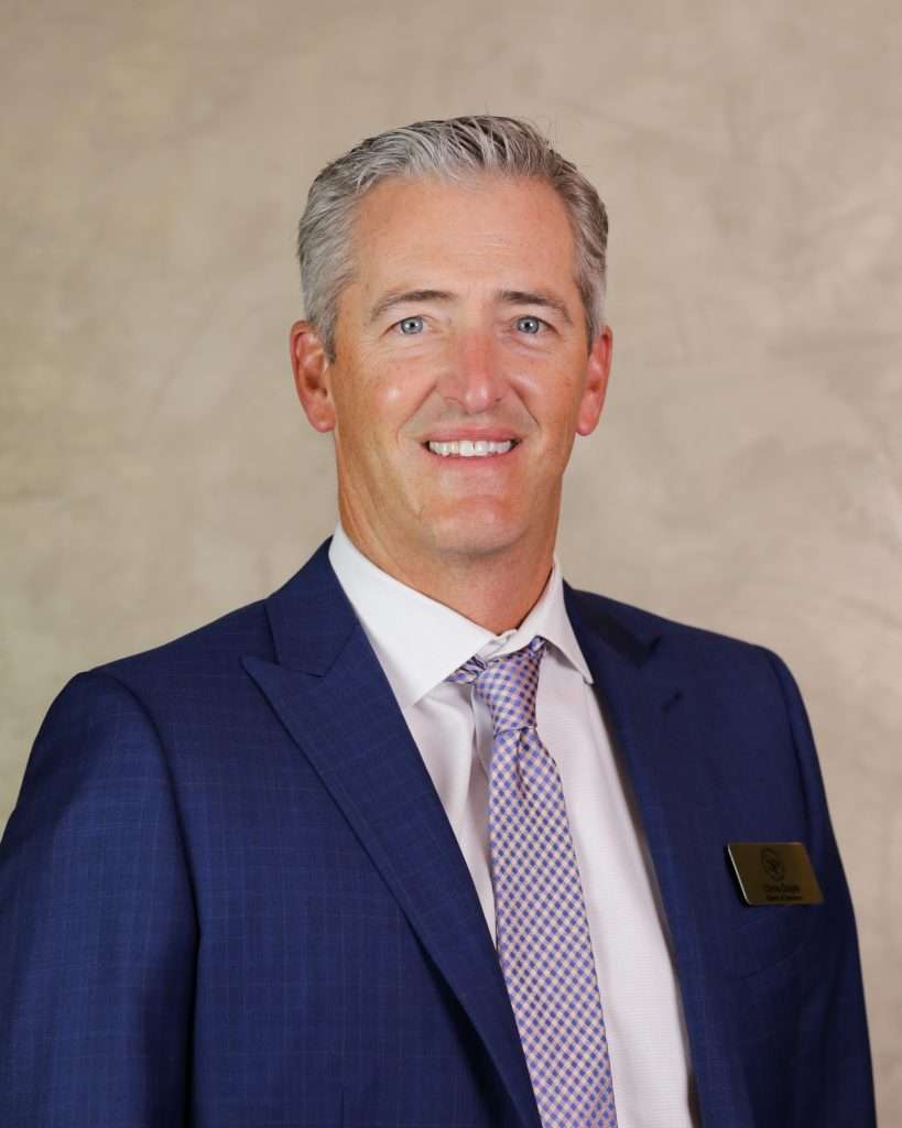 Photo of a man in a suit.
