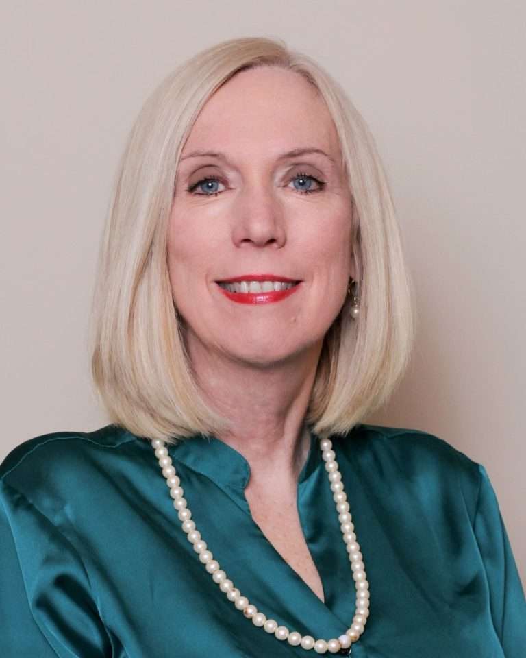 Photo of a woman in a green shirt.