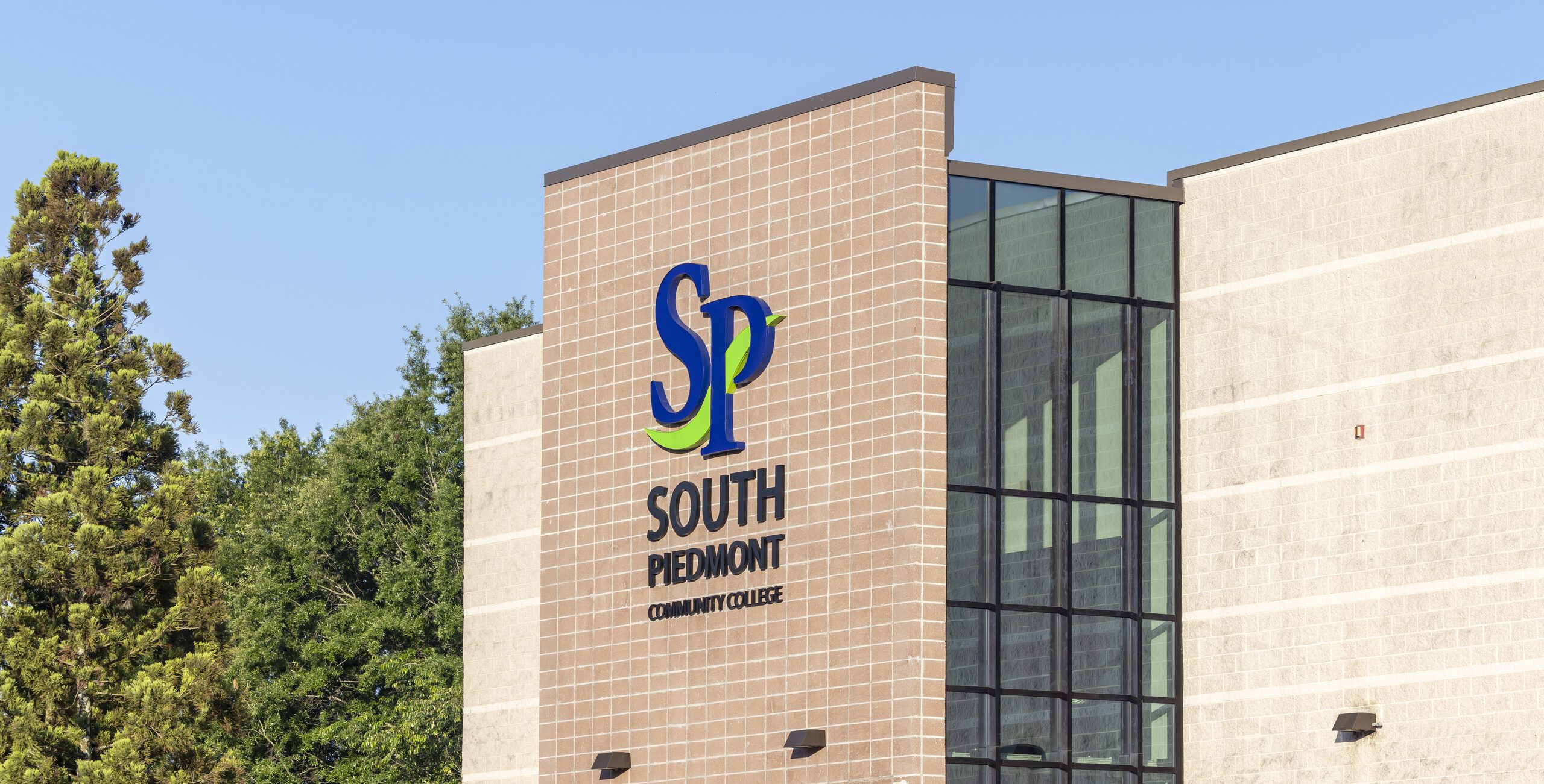 A shot of a South Piedmont building banner displaying the college logo clearly.