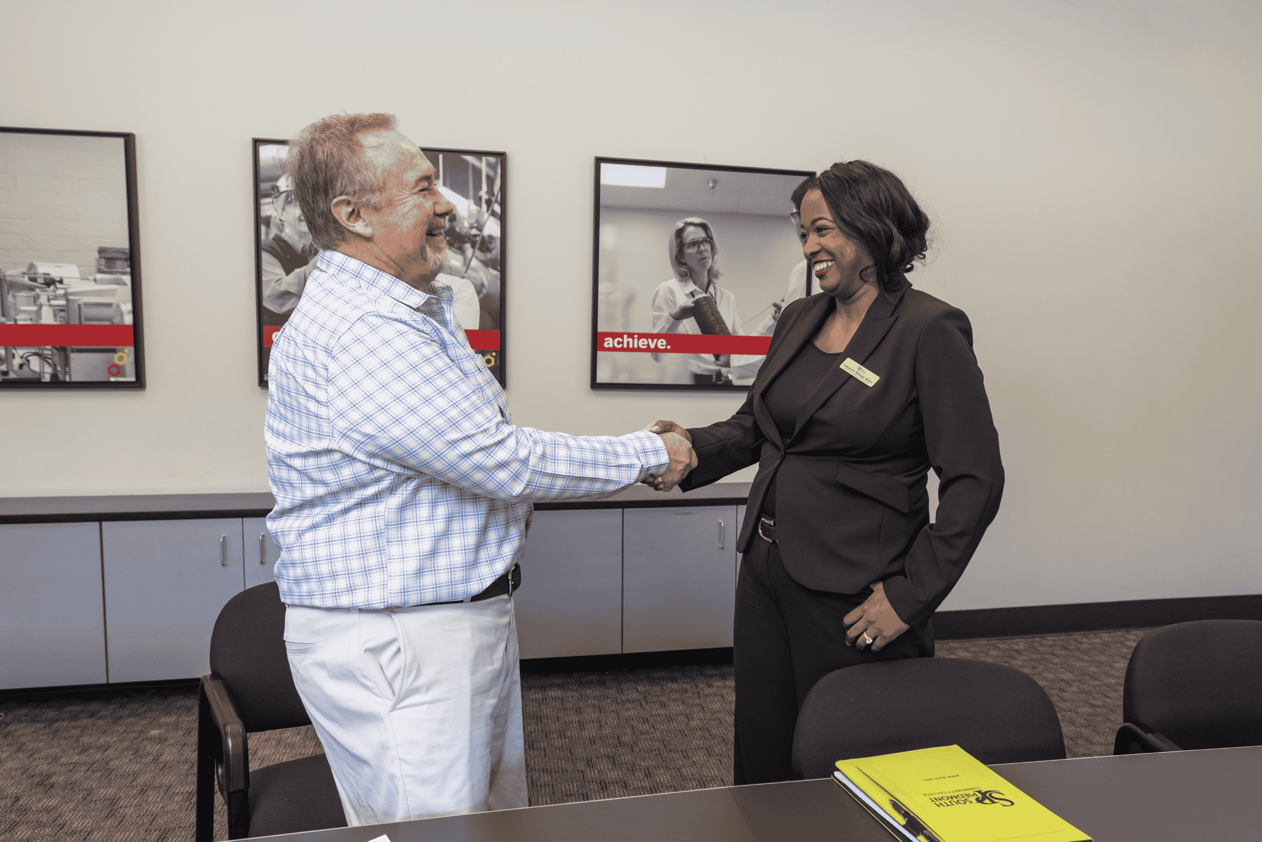 South Piedmont representative shaking hands with Goulston Technologies representative.