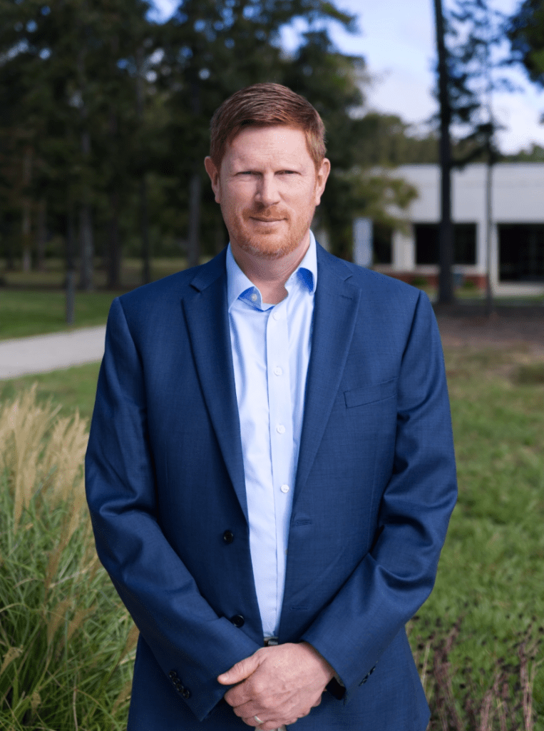 Photo of a man in a suit.