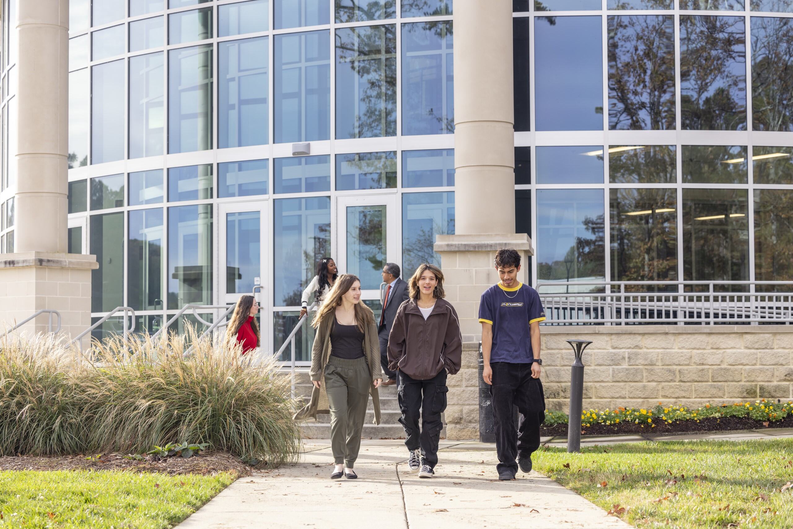 A group of students walking outside the Main Building on the South Piedmont OCH campus.