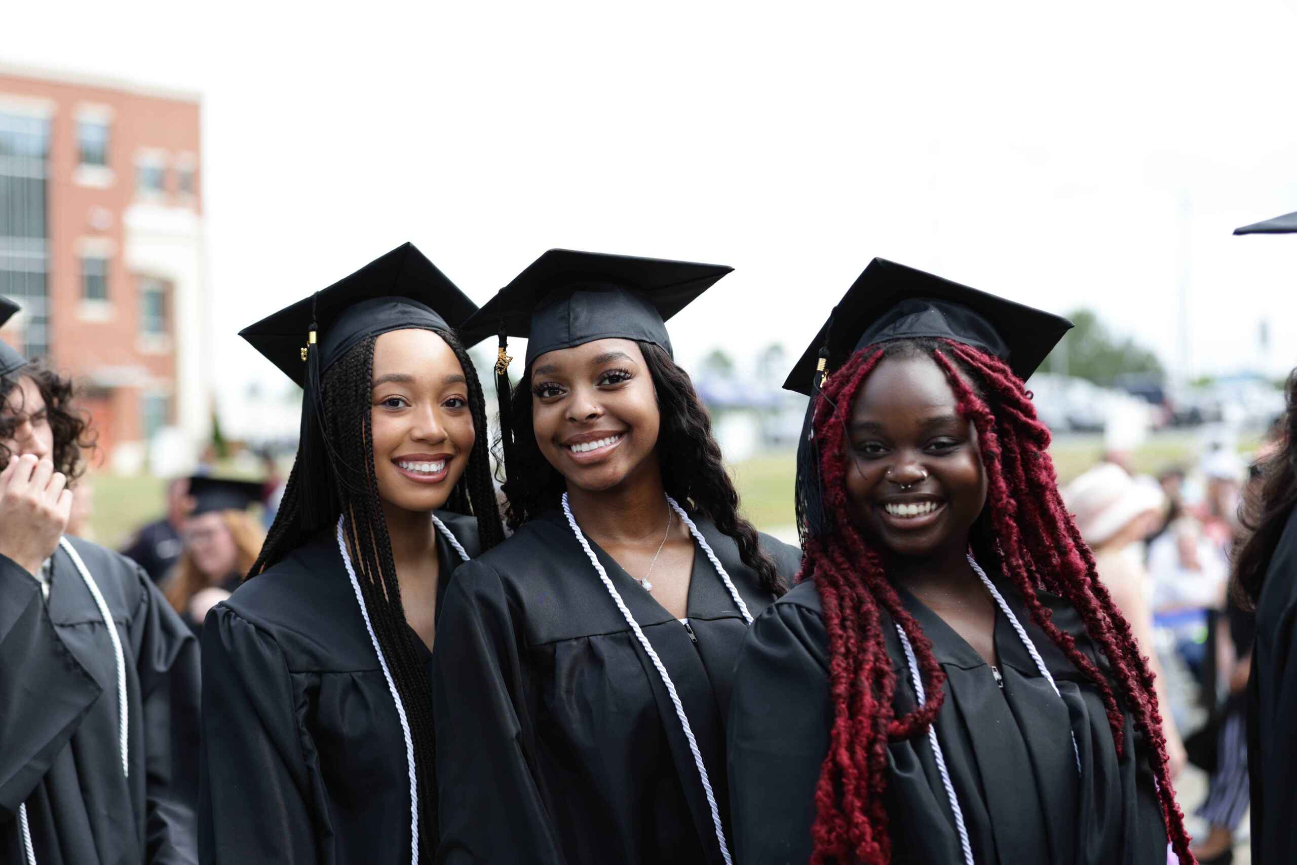 Photo of three female graduates at South Piedmont's commencement.