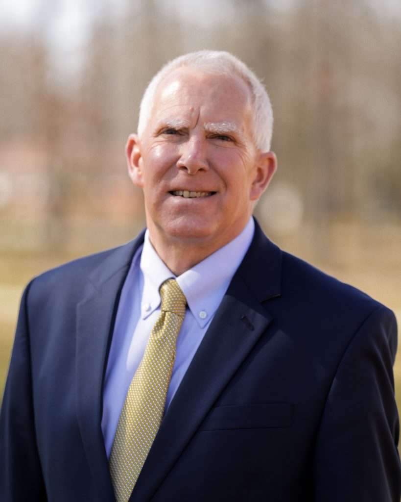 Photo of a man in a suit.
