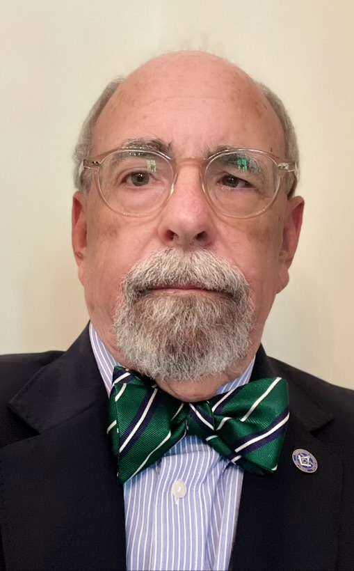 Photo of man in a green bow tie.