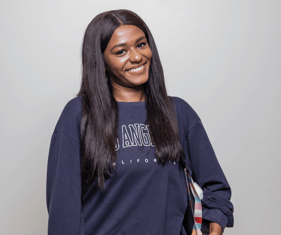Photo of African-American female student smiling at the camera.