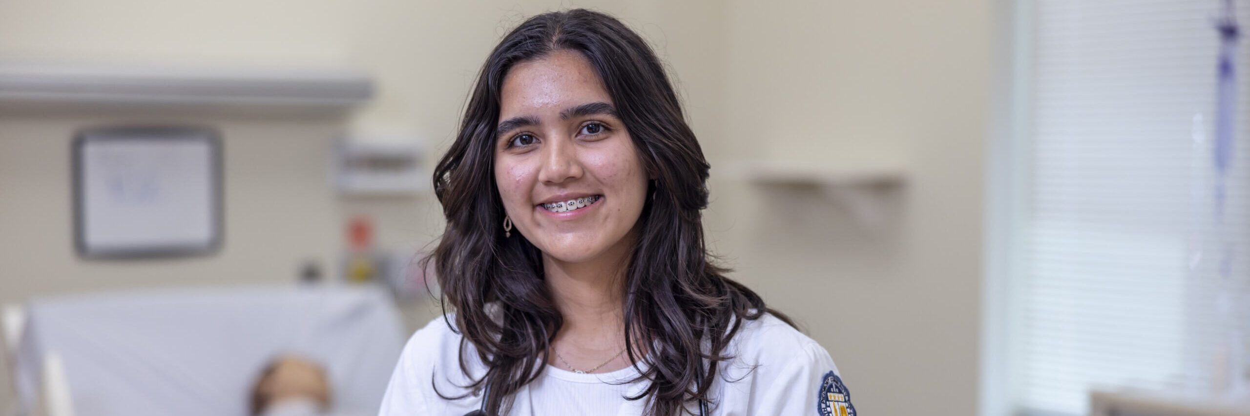 Student in a medical gown.