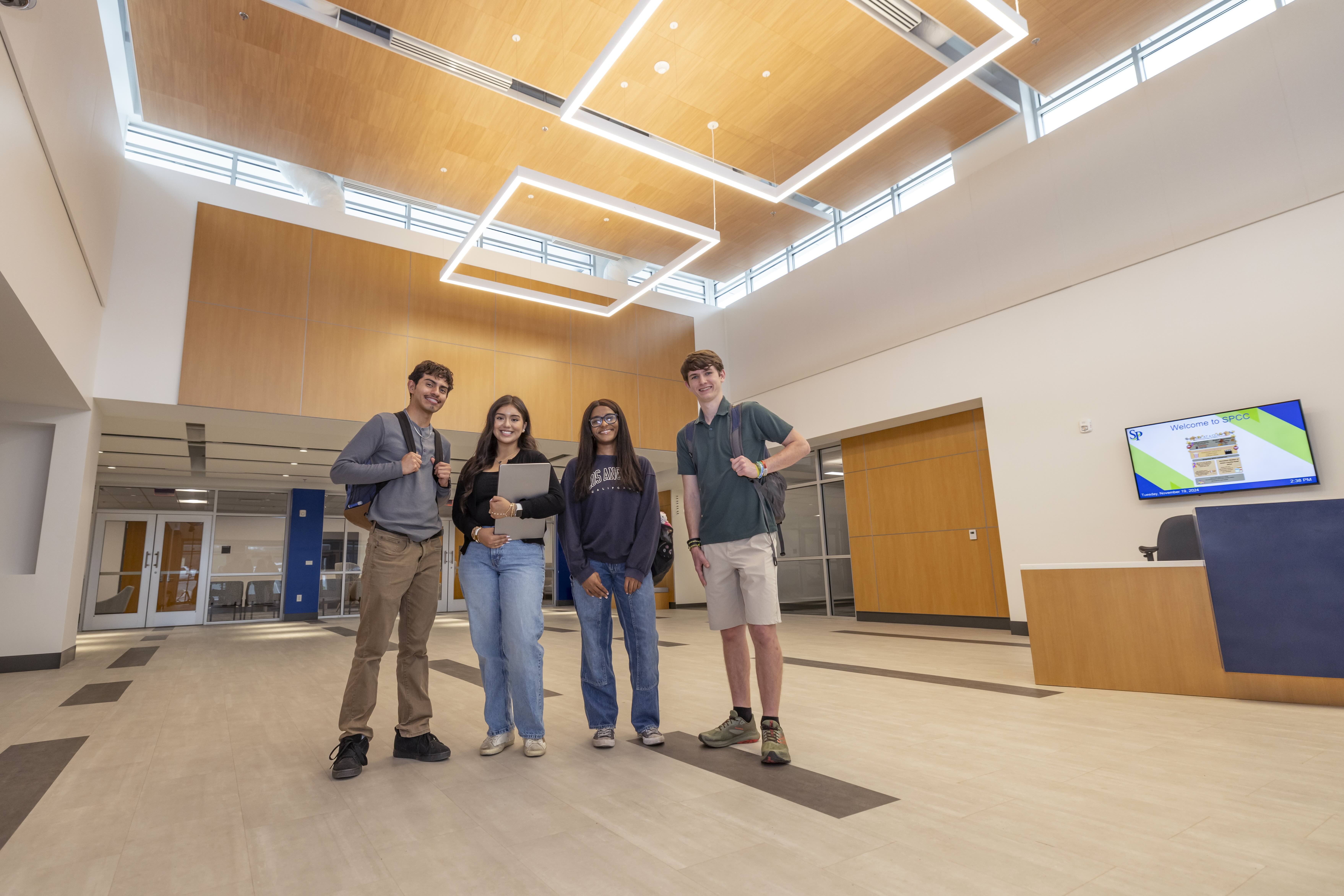 A group of students standing in the lobby of South Piedmont's Building A.