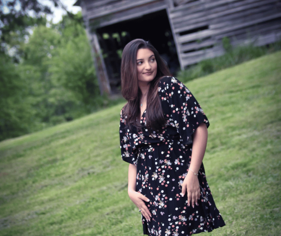 Photo of Kathryn Gouvatsos in a field.