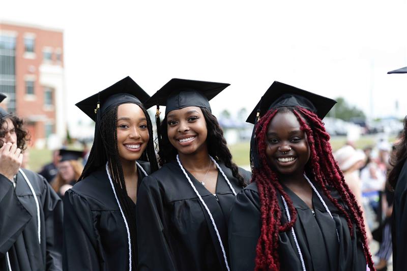 Photo of three female South Piedmont graduates.