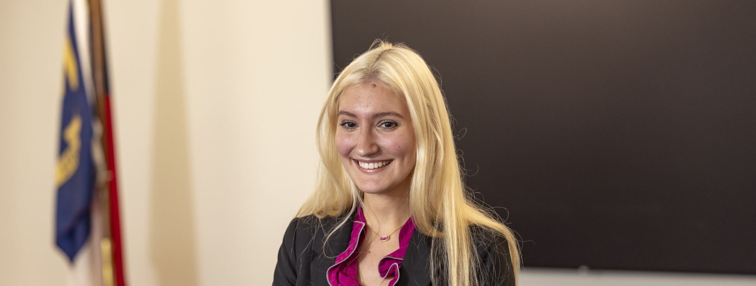 A female student in business attire.