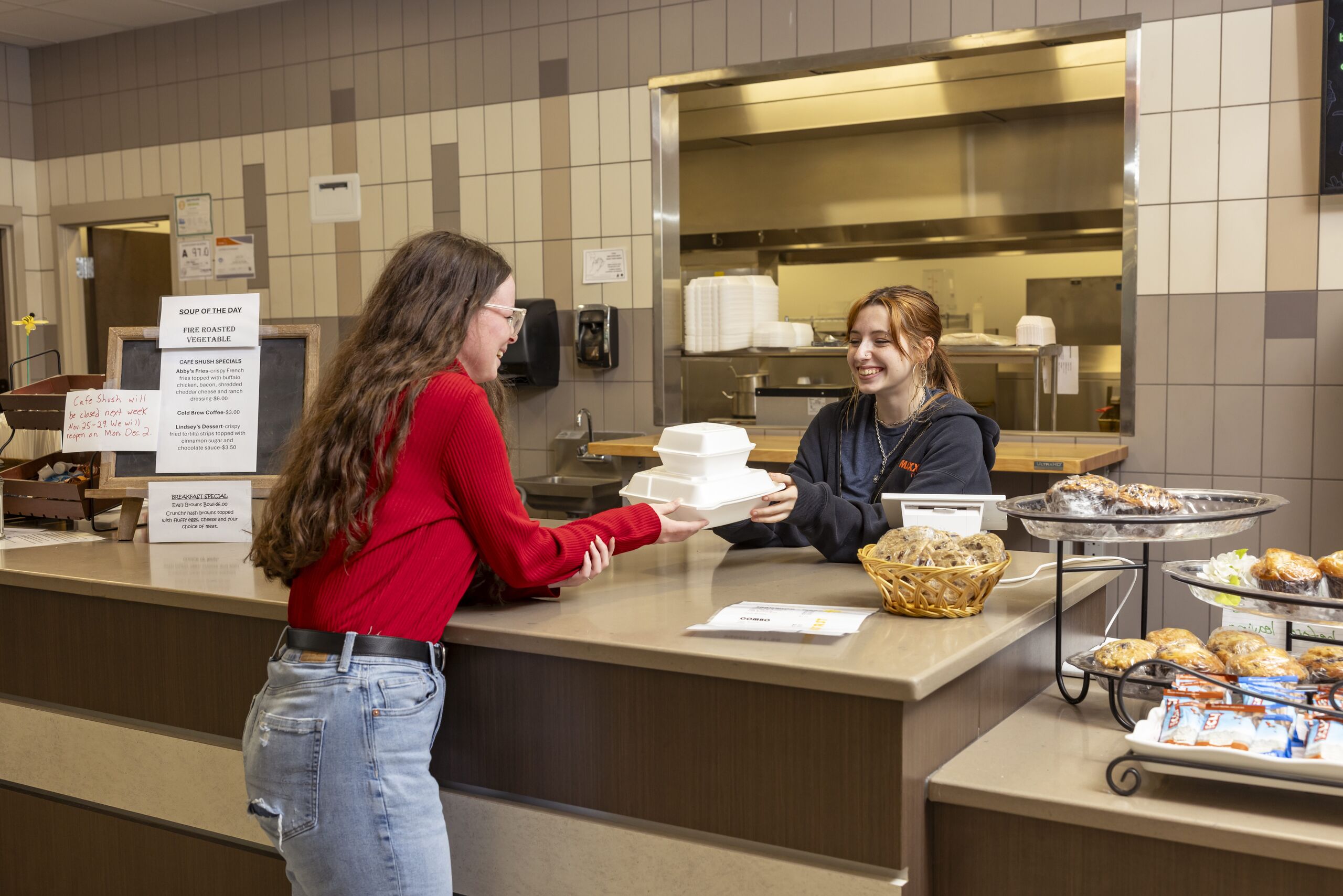 A female student purchasing food at the cafe at South Piedmont.