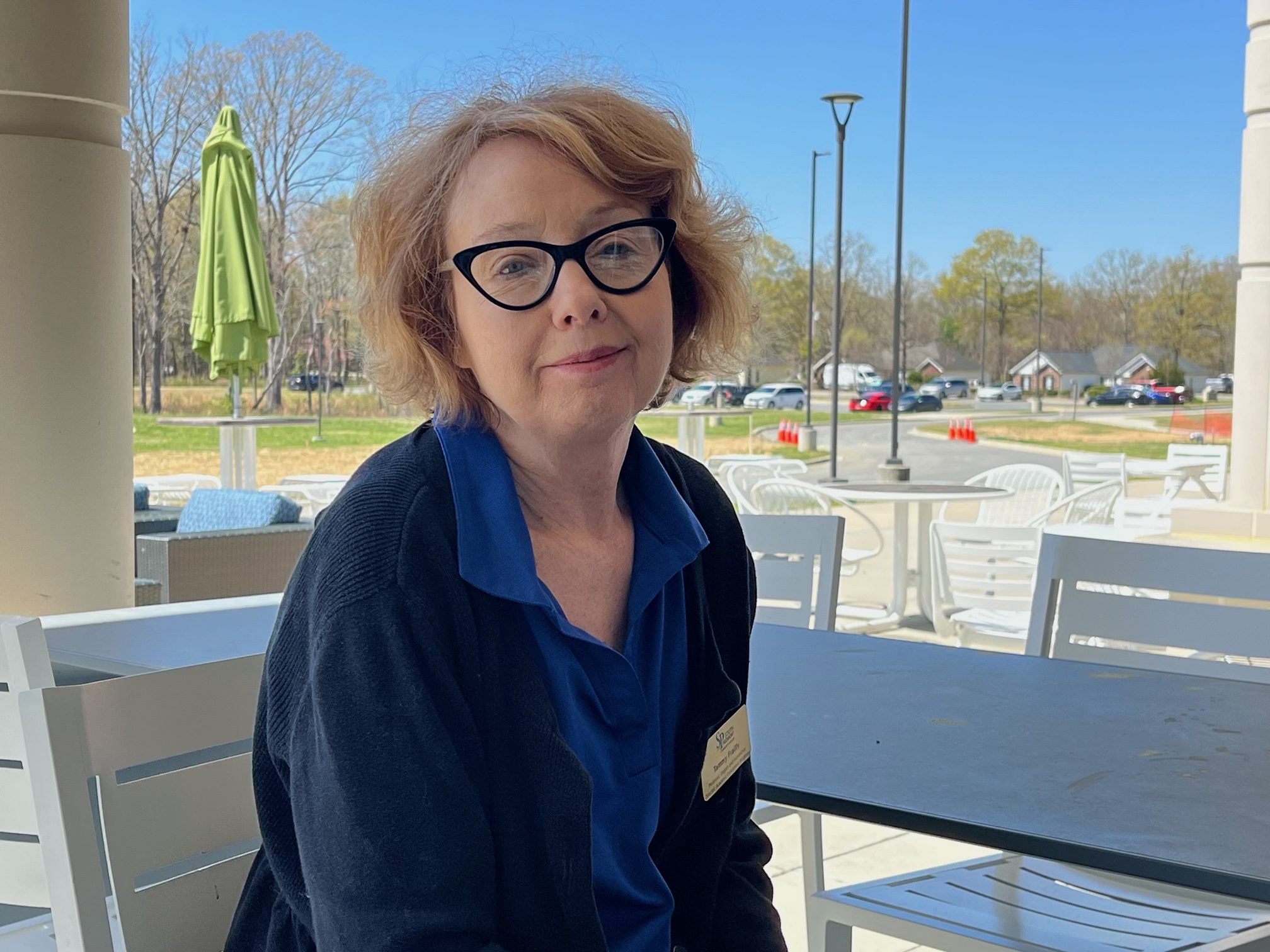 Tammy Frailly sitting on the patio at South Piedmont's OCH campus.