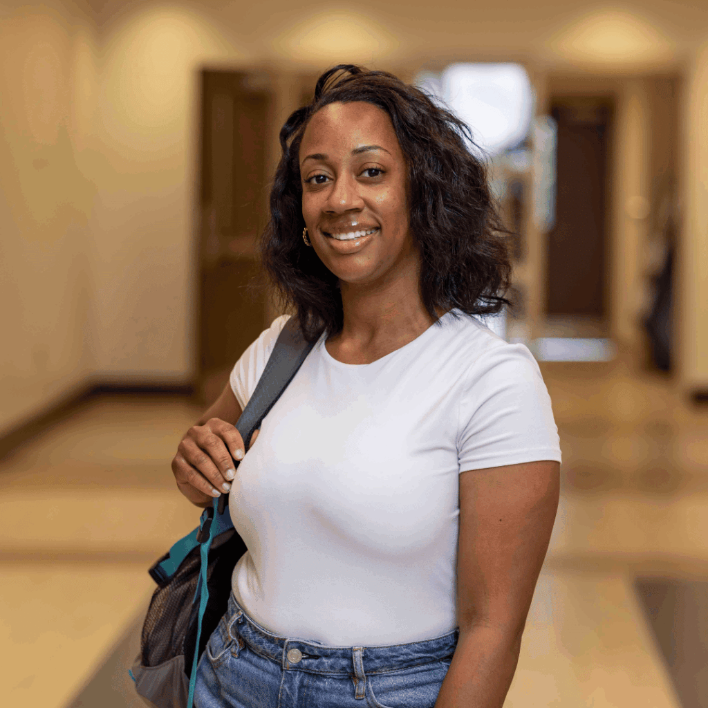 Photo of a female student in a South Piedmont hallway.