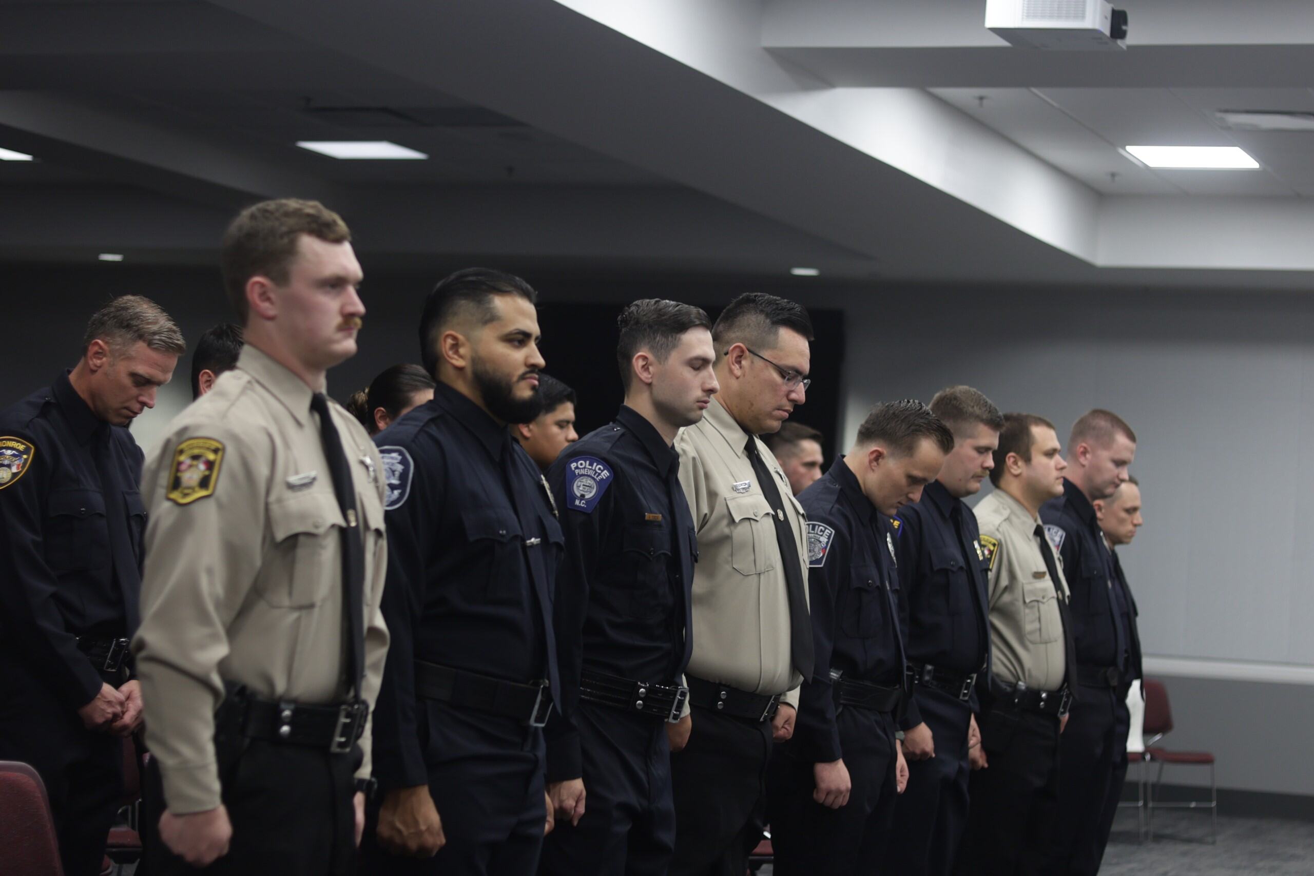 Basic Law Enforcement Training Graduates standing during ceremony.