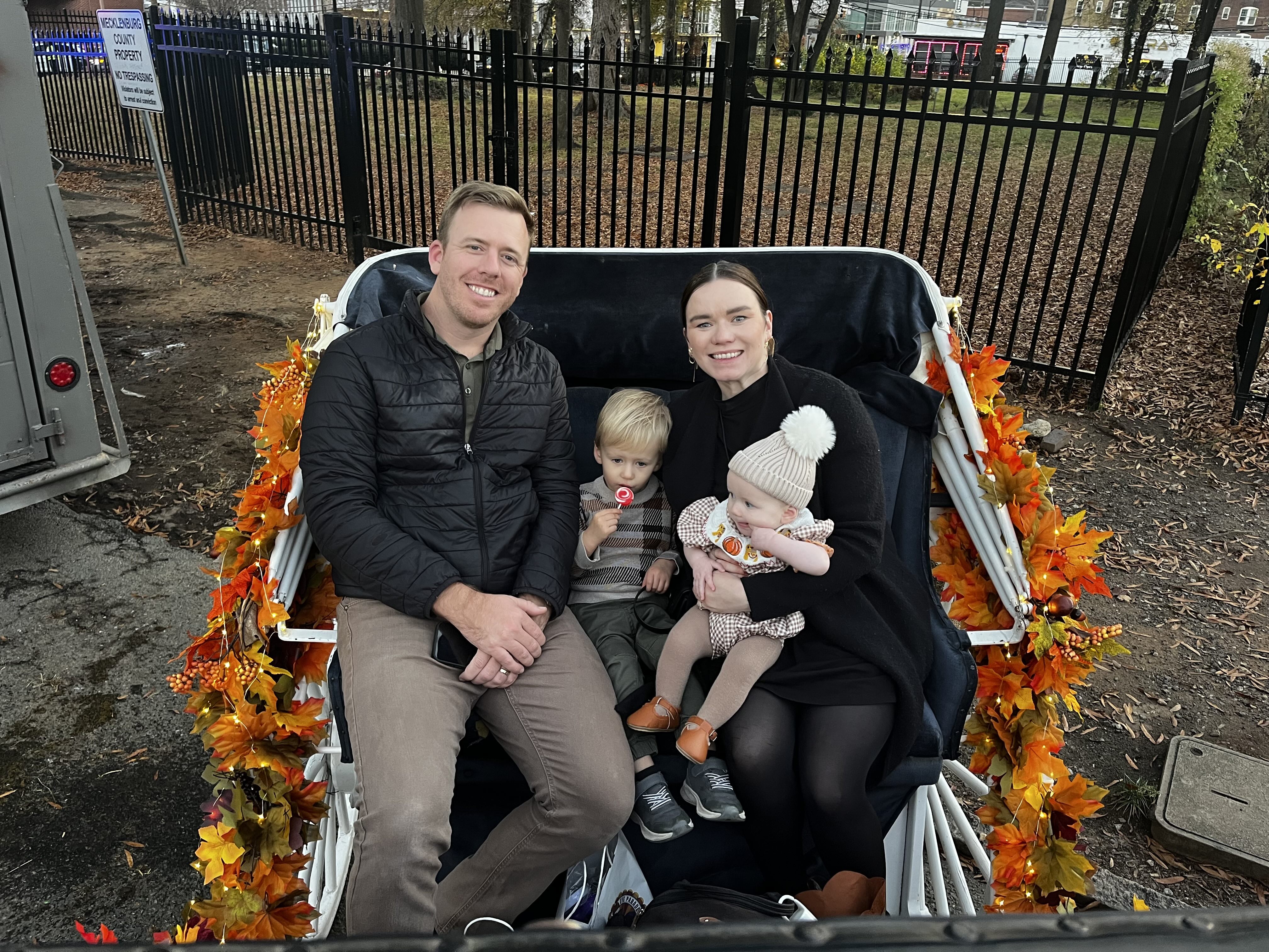 A family in a horsedrawn carriage.