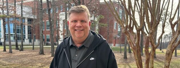 A man standing outside a building.