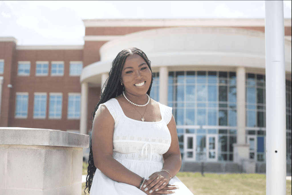 Nyla White in front of Main building at South Piedmont campus.