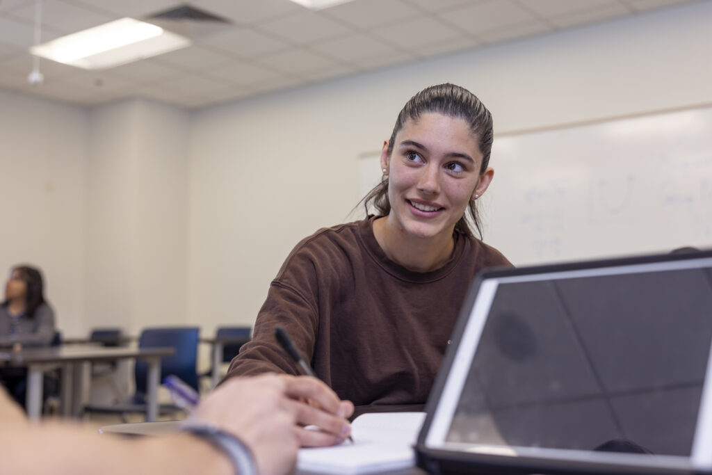 Female student in a classroom setting.
